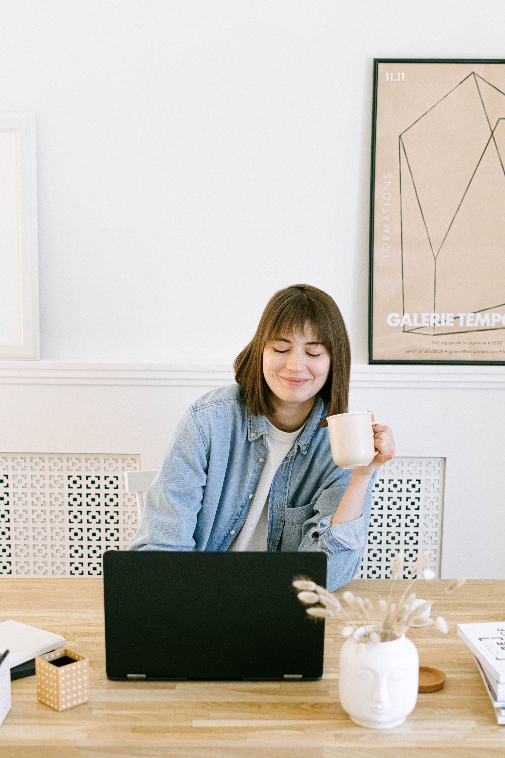 happy girl sitting in front of laptop